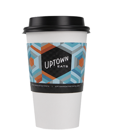 A paper hot cup with a custom printed "Uptown Eats" logo.